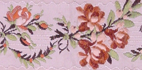 Embroidered flowers on a textile made in 18th century France.