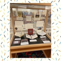 color photograph of display case with materials commemorating the 20th anniversary of Funk ACES Library