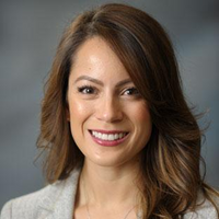 Picture of Susan Aguinaga --- she has brown hair (shoulder length) and brown eyes