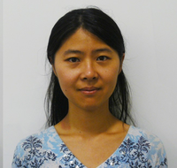 Image of Dr. Chang Cui. She has black hair and is wearing a blue and white print blouse.